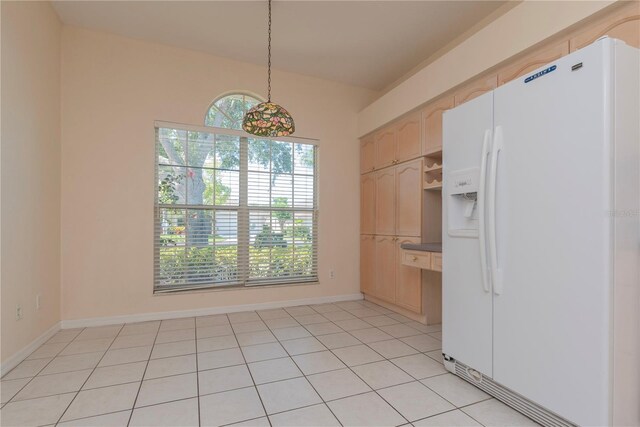 1126 Haley Ln, Dunedin, FL 34698 - unfurnished dining area with baseboards and light tile patterned floors
