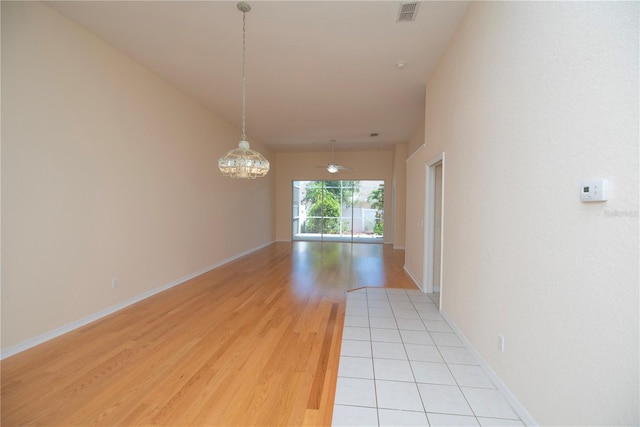 1126 Haley Ln, Dunedin, FL 34698 - hallway with light wood-style floors and baseboards