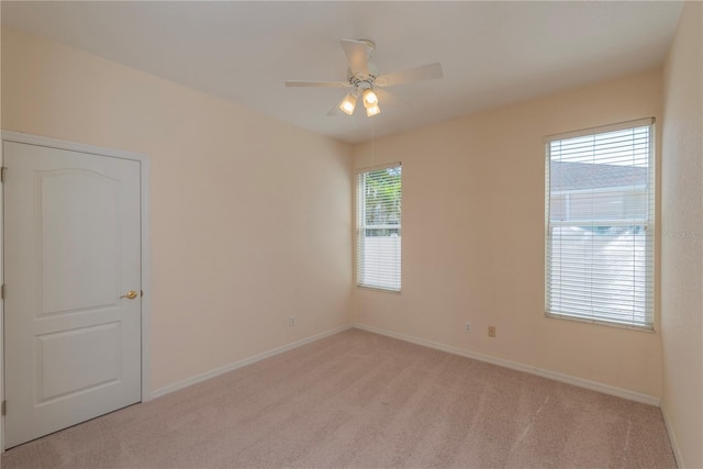 1126 Haley Ln, Dunedin, FL 34698 - carpeted empty room featuring a ceiling fan and baseboards