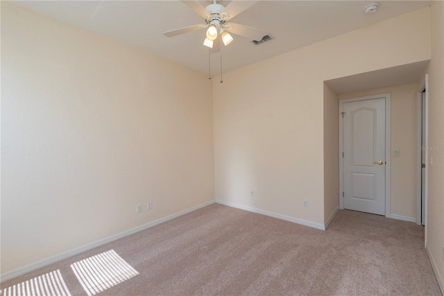 1126 Haley Ln, Dunedin, FL 34698 - spare room featuring light colored carpet, a smoke detector, ceiling fan, and baseboards