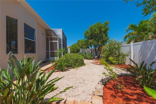 1126 Haley Ln, Dunedin, FL 34698 - fenced backyard featuring a lanai