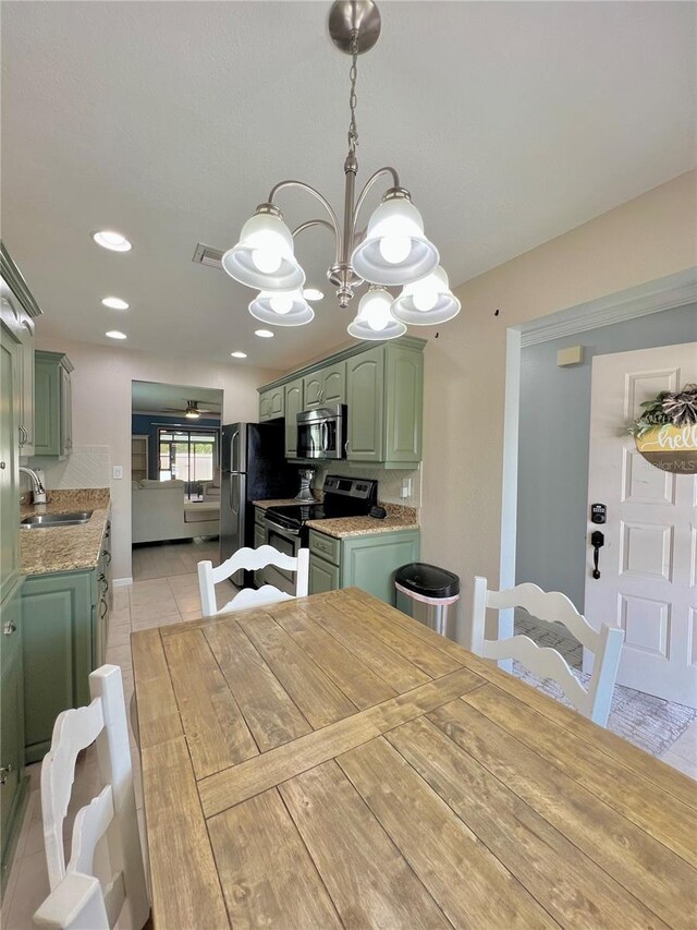 7360 Ulmerton Rd Unit 16A, Largo, FL 33771 - dining space with a chandelier, light tile patterned floors, and recessed lighting