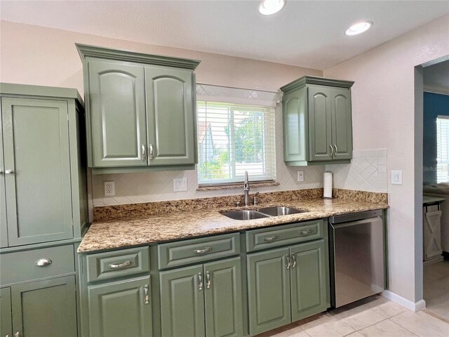 7360 Ulmerton Rd Unit 16A, Largo, FL 33771 - kitchen featuring green cabinetry, dishwasher, a sink, and recessed lighting