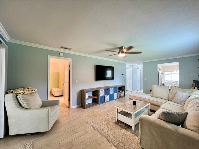 7360 Ulmerton Rd Unit 16A, Largo, FL 33771 - living room with a ceiling fan, crown molding, light wood-style floors, and baseboards