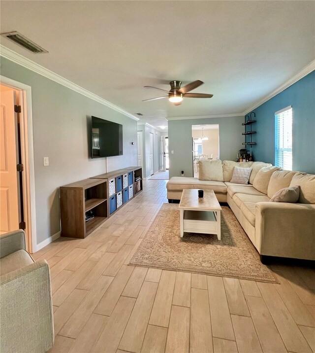 7360 Ulmerton Rd Unit 16A, Largo, FL 33771 - living area featuring light wood-style floors, a ceiling fan, ornamental molding, and baseboards