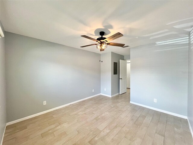 7360 Ulmerton Rd Unit 16A, Largo, FL 33771 - unfurnished room with light wood-style flooring, ceiling fan, and baseboards