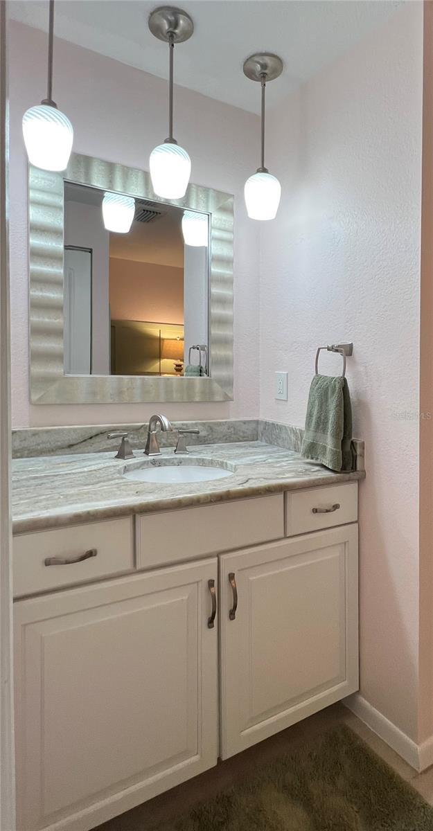 7360 Ulmerton Rd Unit 16A, Largo, FL 33771 - bathroom featuring vanity and baseboards