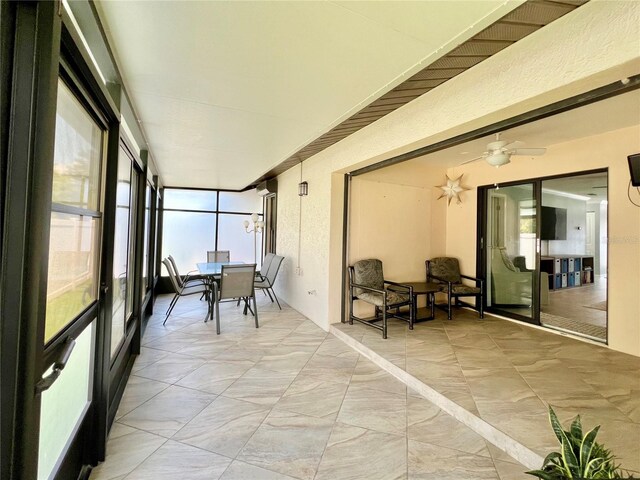 7360 Ulmerton Rd Unit 16A, Largo, FL 33771 - sunroom / solarium with a ceiling fan and outdoor dining space