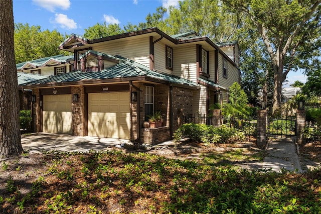 2665 Sequoia Ter Unit 306, Palm Harbor, FL 34683 - view of front of property featuring a garage, brick siding, driveway, and fence
