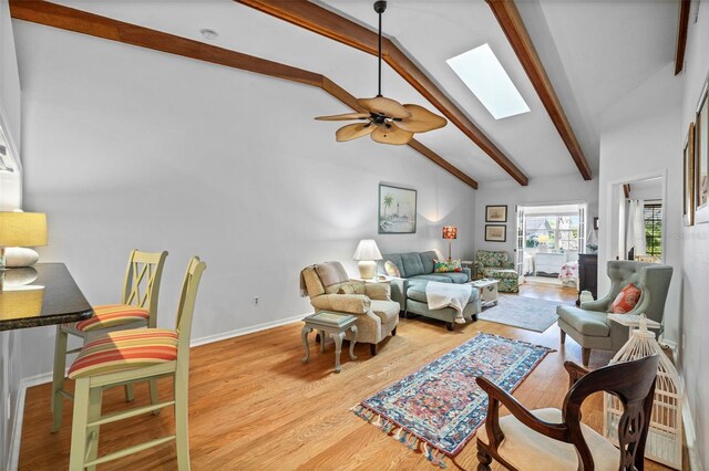 2665 Sequoia Ter Unit 306, Palm Harbor, FL 34683 - living room with a skylight, a ceiling fan, wood finished floors, and baseboards