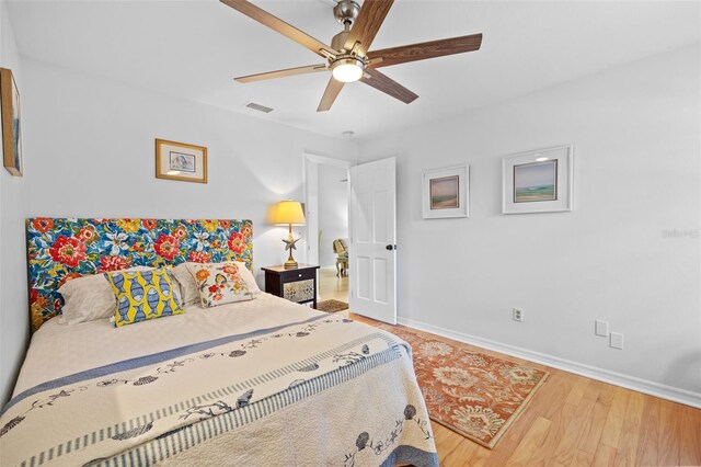 2665 Sequoia Ter Unit 306, Palm Harbor, FL 34683 - bedroom with baseboards, wood finished floors, and ceiling fan