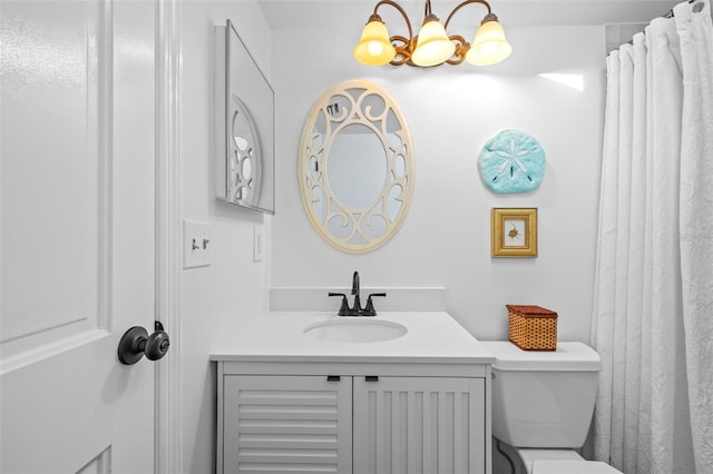 2665 Sequoia Ter Unit 306, Palm Harbor, FL 34683 - bathroom featuring vanity, toilet, and a chandelier