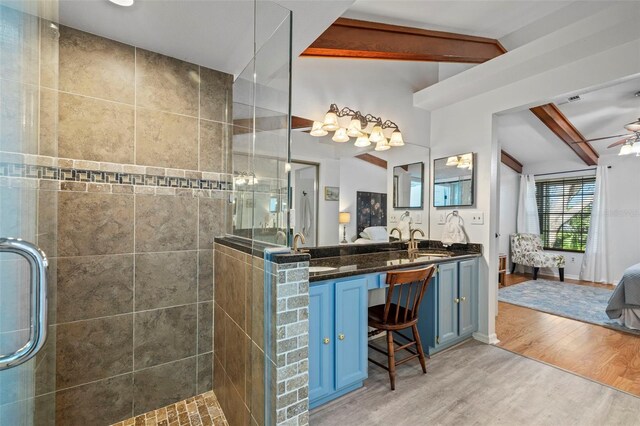 2665 Sequoia Ter Unit 306, Palm Harbor, FL 34683 - bathroom featuring connected bathroom, walk in shower, wood finished floors, and ceiling fan