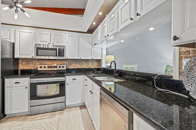2665 Sequoia Ter Unit 306, Palm Harbor, FL 34683 - kitchen with appliances with stainless steel finishes, a sink, and white cabinets