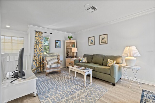 2665 Sequoia Ter Unit 306, Palm Harbor, FL 34683 - living room featuring crown molding, light wood finished floors, and baseboards