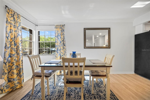 2665 Sequoia Ter Unit 306, Palm Harbor, FL 34683 - dining room with wood finished floors, crown molding, and baseboards
