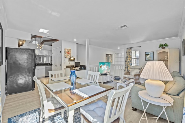 2665 Sequoia Ter Unit 306, Palm Harbor, FL 34683 - dining room featuring ornamental molding, light wood-type flooring, and recessed lighting