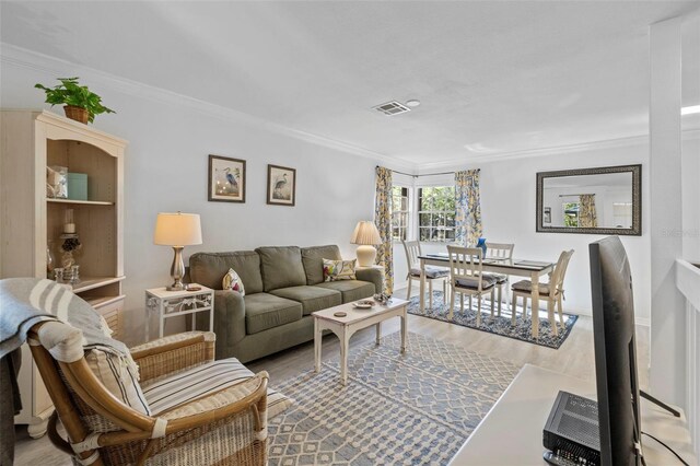 2665 Sequoia Ter Unit 306, Palm Harbor, FL 34683 - living room featuring crown molding and wood finished floors