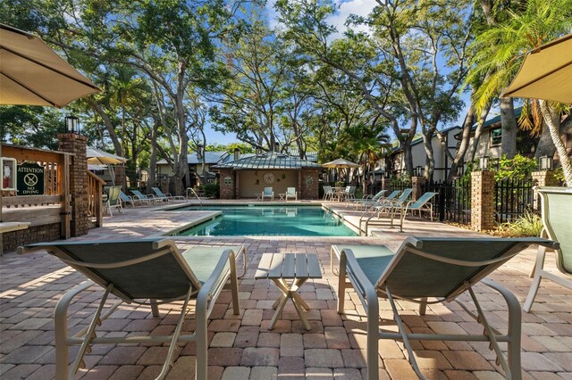 2665 Sequoia Ter Unit 306, Palm Harbor, FL 34683 - community pool with a patio and fence