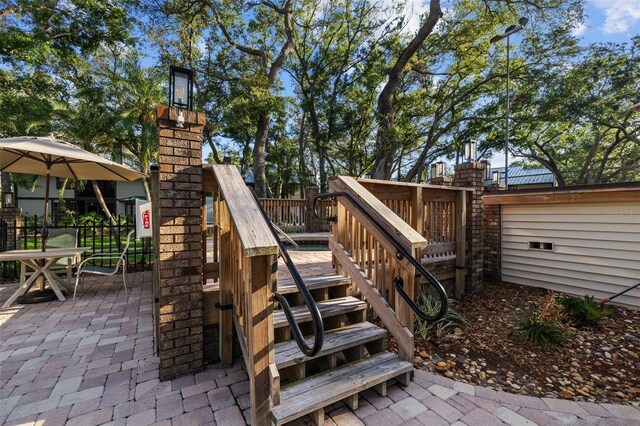 2665 Sequoia Ter Unit 306, Palm Harbor, FL 34683 - view of patio / terrace featuring a deck, stairway, and fence
