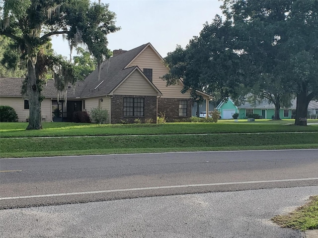 2615 Southern Oaks Pl, Plant City, FL 33566 - view of front of property featuring brick siding and a front yard