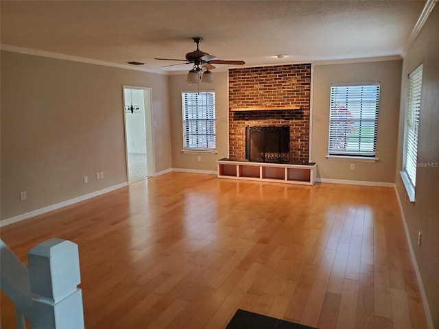 2615 Southern Oaks Pl, Plant City, FL 33566 - unfurnished living room featuring ceiling fan, ornamental molding, wood finished floors, healthy amount of natural light, and baseboards