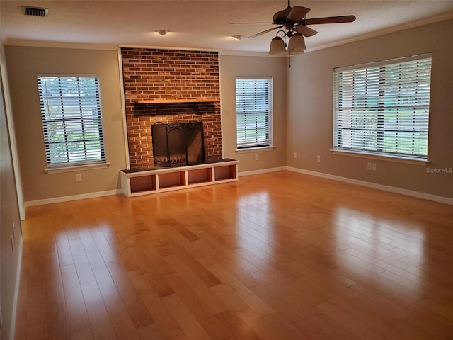 2615 Southern Oaks Pl, Plant City, FL 33566 - unfurnished living room with crown molding, ceiling fan, plenty of natural light, and wood finished floors