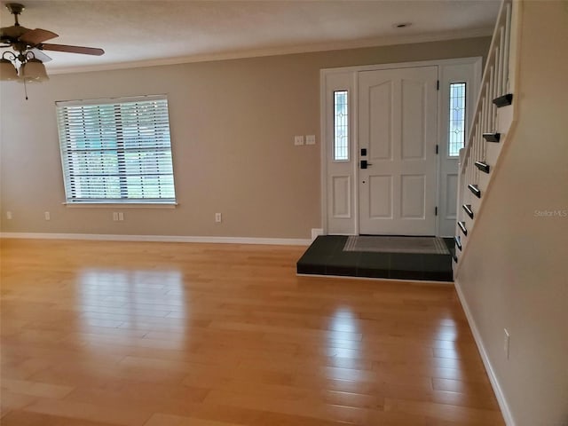 2615 Southern Oaks Pl, Plant City, FL 33566 - entryway featuring ornamental molding, light wood-type flooring, stairway, a ceiling fan, and baseboards