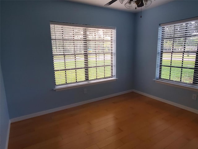 2615 Southern Oaks Pl, Plant City, FL 33566 - empty room with ceiling fan, wood finished floors, and baseboards