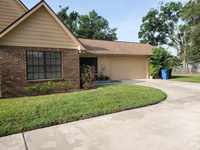 2615 Southern Oaks Pl, Plant City, FL 33566 - ranch-style home featuring a garage, driveway, a front yard, and brick siding
