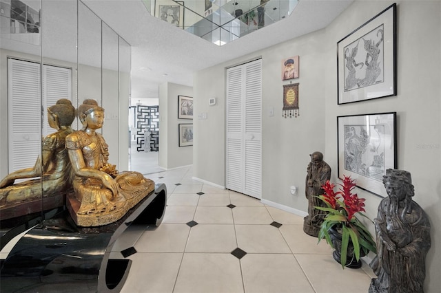 1340 Gulf Blvd Unit 16A, Clearwater Beach, FL 33767 - foyer with light tile patterned floors and baseboards