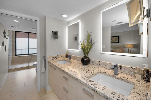 1340 Gulf Blvd Unit 16A, Clearwater Beach, FL 33767 - full bath with tile patterned floors, double vanity, recessed lighting, baseboards, and a walk in shower
