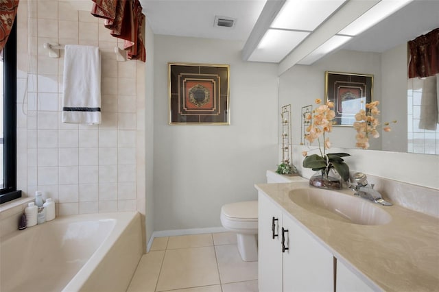 1340 Gulf Blvd Unit 16A, Clearwater Beach, FL 33767 - full bath featuring tile patterned flooring, a tub to relax in, toilet, vanity, and baseboards