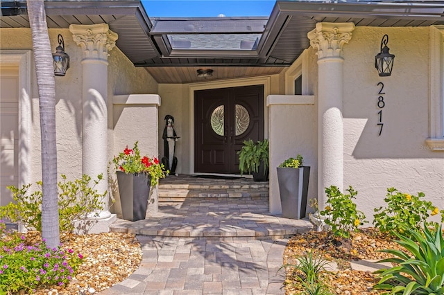 2817 Seabreeze Dr S, Gulfport, FL 33707 - doorway to property featuring stucco siding