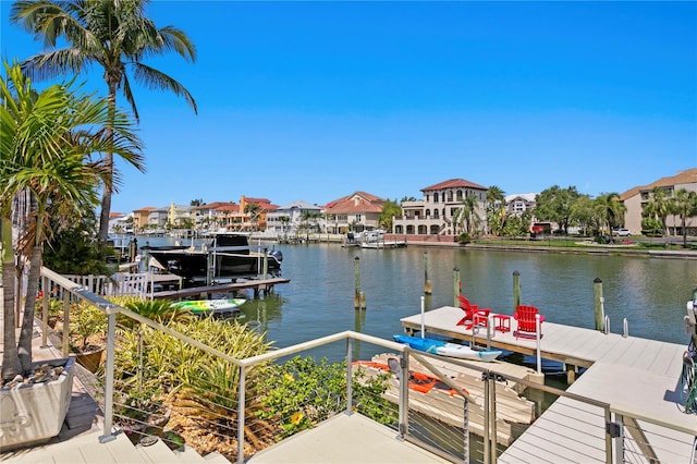 2817 Seabreeze Dr S, Gulfport, FL 33707 - dock area featuring a water view, boat lift, and a residential view