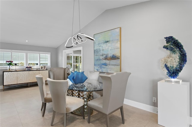 2817 Seabreeze Dr S, Gulfport, FL 33707 - dining space featuring lofted ceiling, baseboards, and tile patterned flooring
