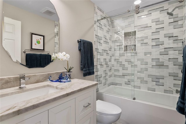 2817 Seabreeze Dr S, Gulfport, FL 33707 - bathroom with toilet, vanity, and enclosed tub / shower combo