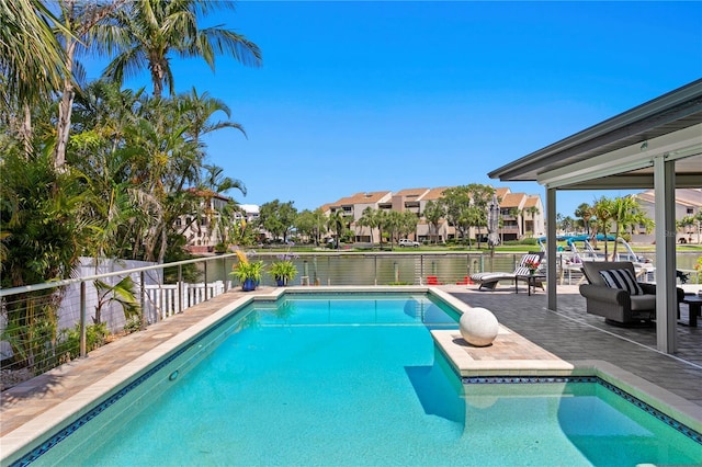 2817 Seabreeze Dr S, Gulfport, FL 33707 - view of swimming pool with a fenced backyard, a patio area, and a water view