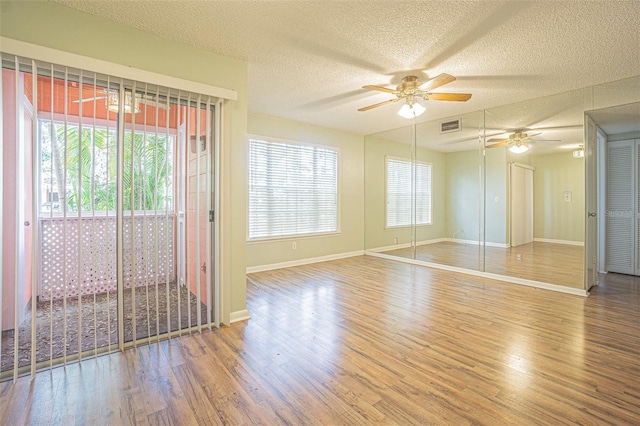 3002 W Cleveland St Unit C3, Tampa, FL 33609 - spare room with ceiling fan, wood finished floors, baseboards, and a textured ceiling