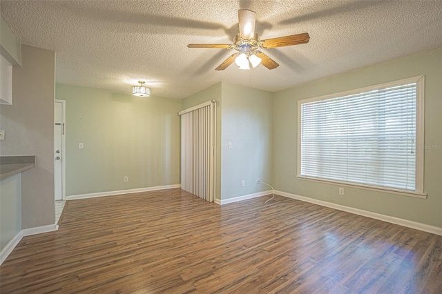 3002 W Cleveland St Unit C3, Tampa, FL 33609 - spare room featuring wood finished floors, a textured ceiling, a ceiling fan, and baseboards