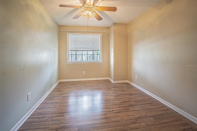 3002 W Cleveland St Unit C3, Tampa, FL 33609 - empty room featuring a textured ceiling, dark wood-style floors, a ceiling fan, baseboards, and a textured wall
