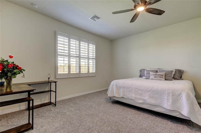 bedroom featuring carpet flooring, baseboards, and a ceiling fan