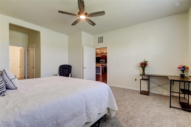carpeted bedroom with baseboards and a ceiling fan