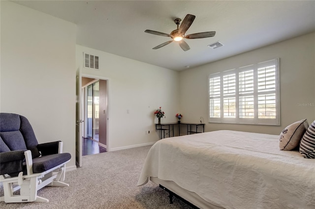 carpeted bedroom with baseboards and a ceiling fan
