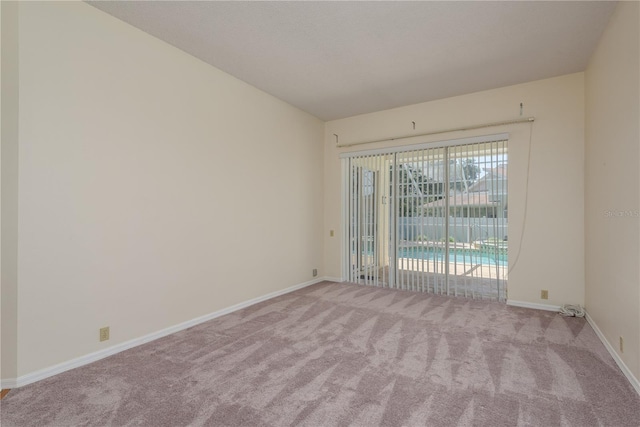 627 Belted Kingfisher Dr N, Palm Harbor, FL 34683 - empty room featuring carpet floors and baseboards