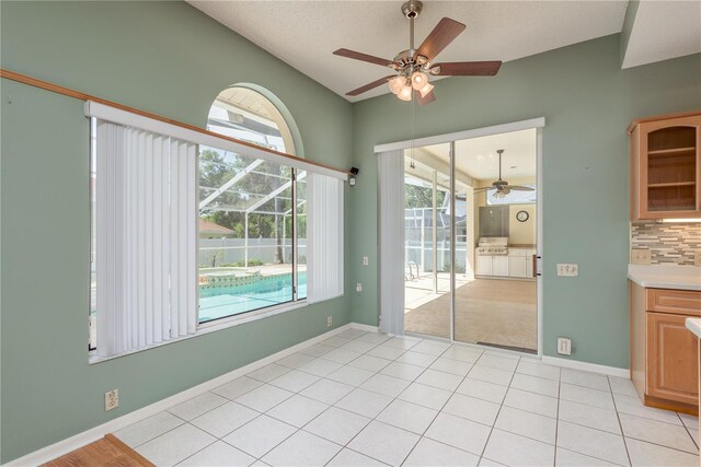 627 Belted Kingfisher Dr N, Palm Harbor, FL 34683 - unfurnished dining area featuring ceiling fan and light tile patterned flooring