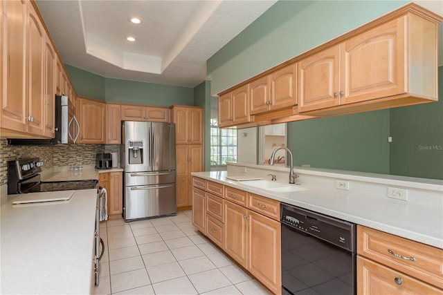 627 Belted Kingfisher Dr N, Palm Harbor, FL 34683 - kitchen with stainless steel appliances, a sink, light countertops, tasteful backsplash, and recessed lighting