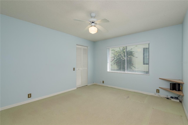 627 Belted Kingfisher Dr N, Palm Harbor, FL 34683 - unfurnished room with light colored carpet, ceiling fan, and baseboards