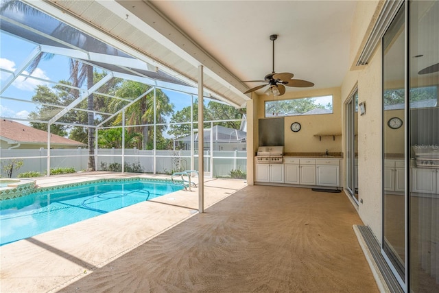 627 Belted Kingfisher Dr N, Palm Harbor, FL 34683 - view of pool featuring a ceiling fan, a sink, a patio area, glass enclosure, and a pool with connected hot tub