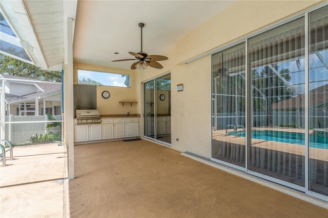 627 Belted Kingfisher Dr N, Palm Harbor, FL 34683 - view of patio featuring ceiling fan, a lanai, and a sink